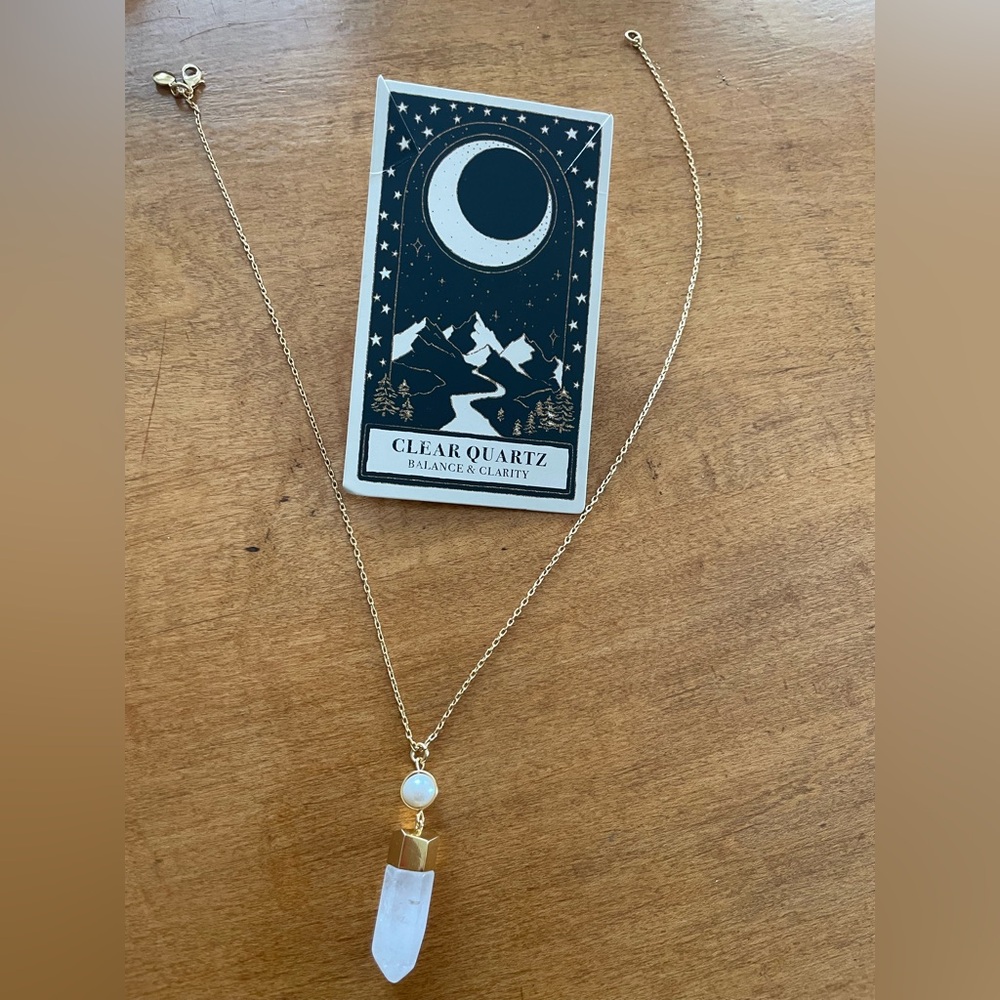 Clear quartz with pearl drop necklace symbolizing balance and clarity